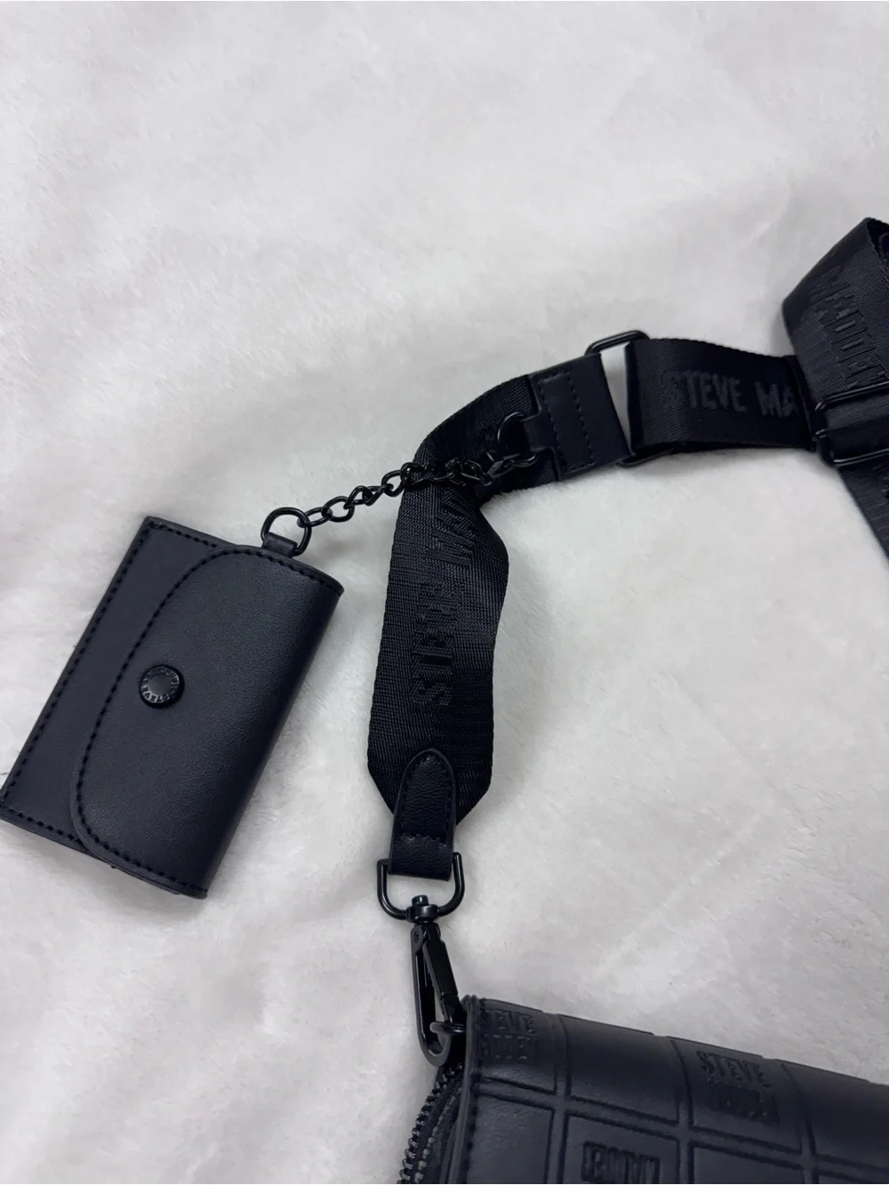 Steve Madden Black Embossed Logo Crossbody Bag.